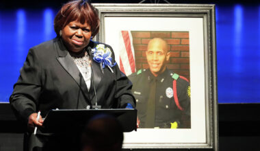 Mother of officer killed in shooting sues alleged gunman's parents