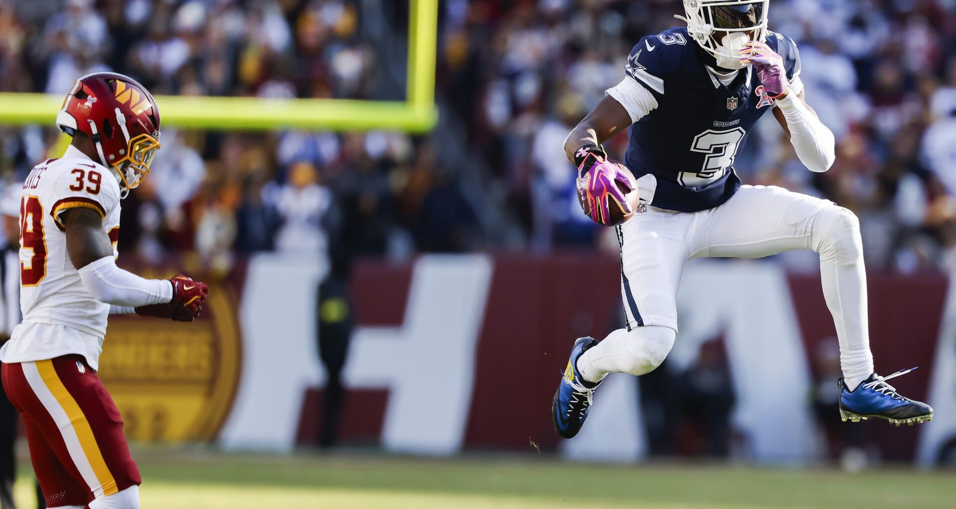 FILE - The WNBA logo is seen near a hoop before an WNBA basketball game at Mohegan Sun Arena, May 14, 2019, in Uncasville, Conn. (AP Photo/Jessica Hill, File)