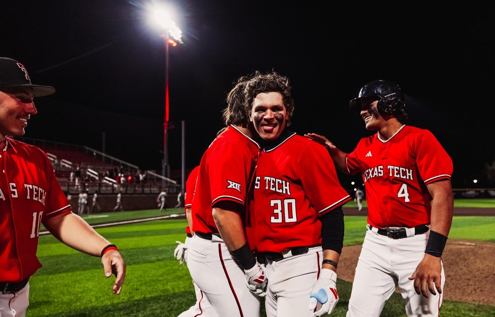 The Red Raiders celebrate Caden Ferraro's Walk-off home run Tuesday night in Tech's 15-4 run-rule win over ACU