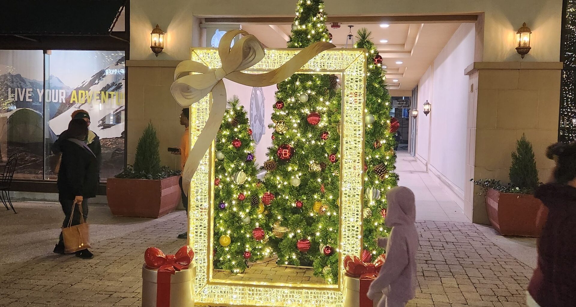 Backdrops ready to capture holiday moments for social media are located throughout Watters Creek Village shopping center in Allen.