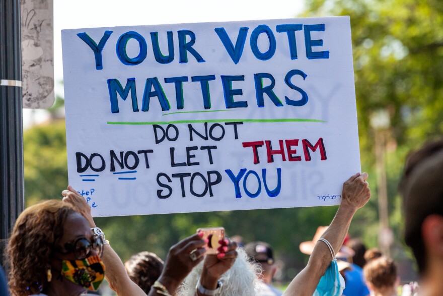 A sign at the flagship event of a nationwide march for voting rights on the 58th anniversary of the March on Washington. Partcipating individuals and organizations demand an end to the filibuster and passage of the John Lewis Voting Rights Advancement Act and the For the People act to ensure federal protection of the right to vote. The event is sponsored by the Drum Major Institute, March On, SEIU, National Action Network, and Future Coalition, and has more than 225 partner organizations. (Photo by Allison Bailey/NurPhoto)NO USE FRANCE