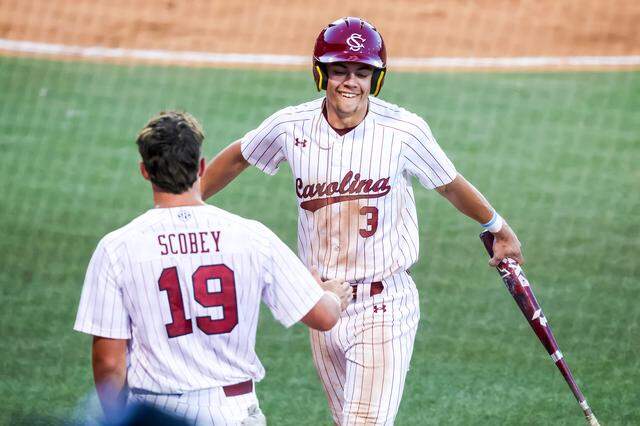 South Carolina Gamecocks infielder Patrick Evans (3) celebrates after scoring against the Texas Longhorns during their game at Founders Park.