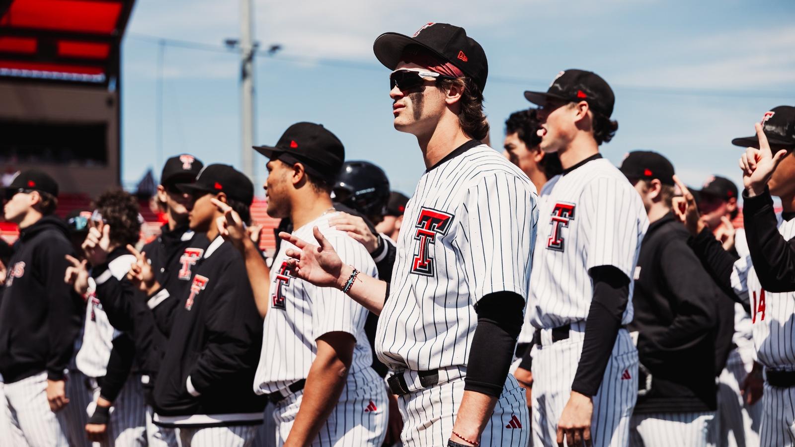 Catcher Matt Quintanar and Infielder Tracer Lopez smile for the camera after Tech's 11-2 win over UH