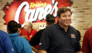 Raising Cane's Chicken Fingers founder Todd Graves (right) visits with employees during a quarterly employee appreciation event.