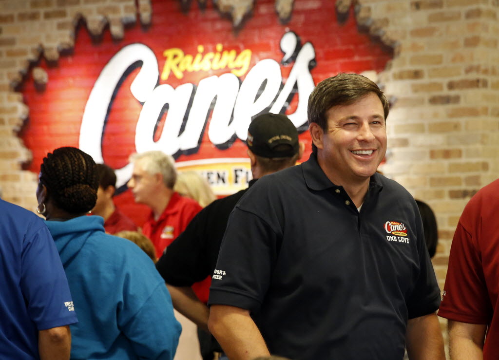 Raising Cane's Chicken Fingers founder Todd Graves (right) visits with employees during a quarterly employee appreciation event.