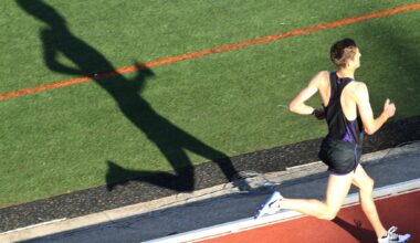 Members of the Little Elm Fire Department watch as schools compete during the final day of the District 11-5A track meet at Lobo Stadium in Little Elm, TX on Monday, April 7, 2025. The meet was suspended Wednesday when Frisco Memorial junior Austin Metcalf was fatally stabbed by a student from another school on the first day of the meet.