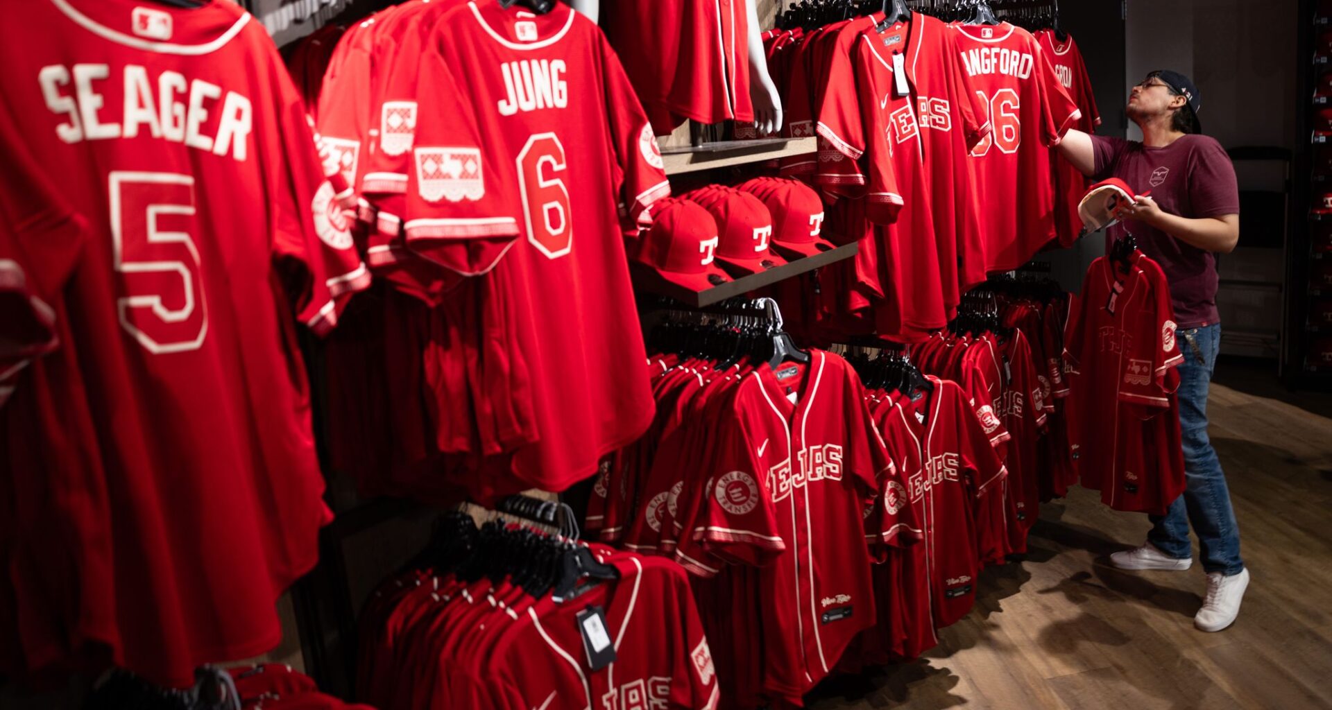 Toddrick Hall of Burleson, TX looks at the new Texas Rangers shortstop Corey Seager’s City Connect jersey at Globe Life Field’s Grand Slam Team Store in Arlington, TX, Thursday, April 9, 2026.