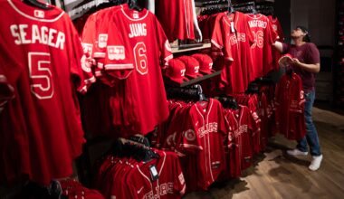 Toddrick Hall of Burleson, TX looks at the new Texas Rangers shortstop Corey Seager’s City Connect jersey at Globe Life Field’s Grand Slam Team Store in Arlington, TX, Thursday, April 9, 2026.