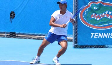 Tanapatt Nirundorn ready to volley at the net in doubles against the LSU Tigers on senior day.