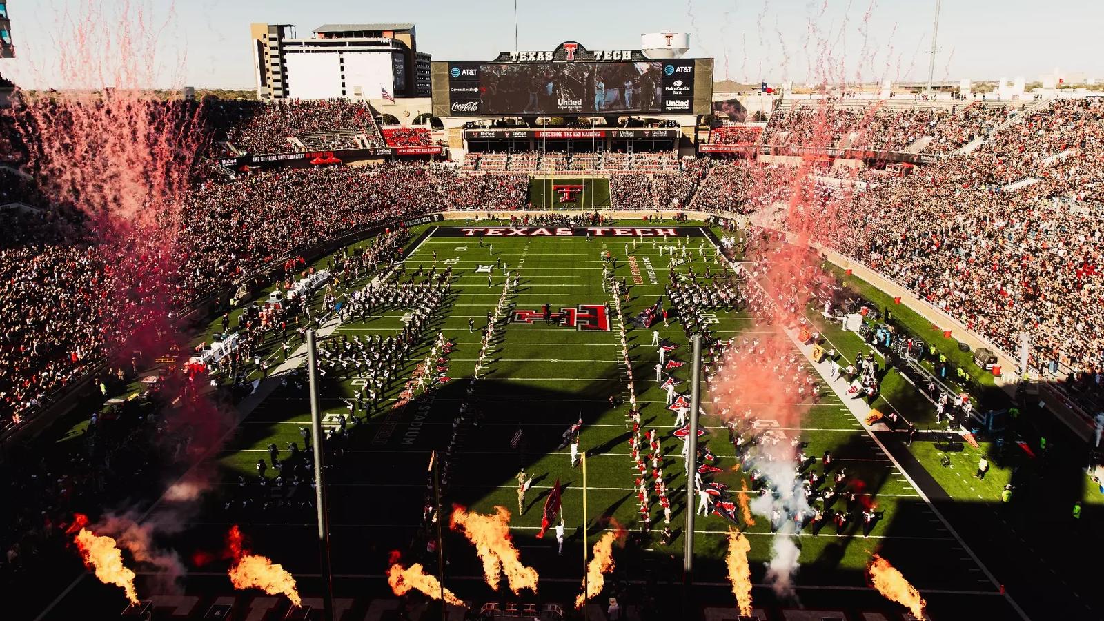 Joey McGuire is pictured in Texas Tech's South End Zone Building press conference room, discussing the Red Raiders' win over BYU in 2025 with members of the media.