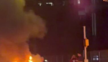 Motorcycle in flames as two people injured after crash near downtown