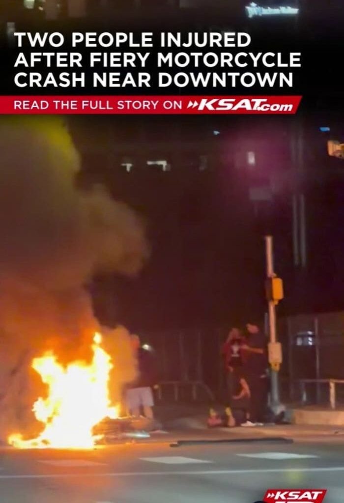 Motorcycle in flames as two people injured after crash near downtown