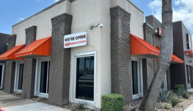 Despite the banner hanging outside the Hooters location in Corpus Christi on April 13, a sign in the door states that the business closed the previous day.