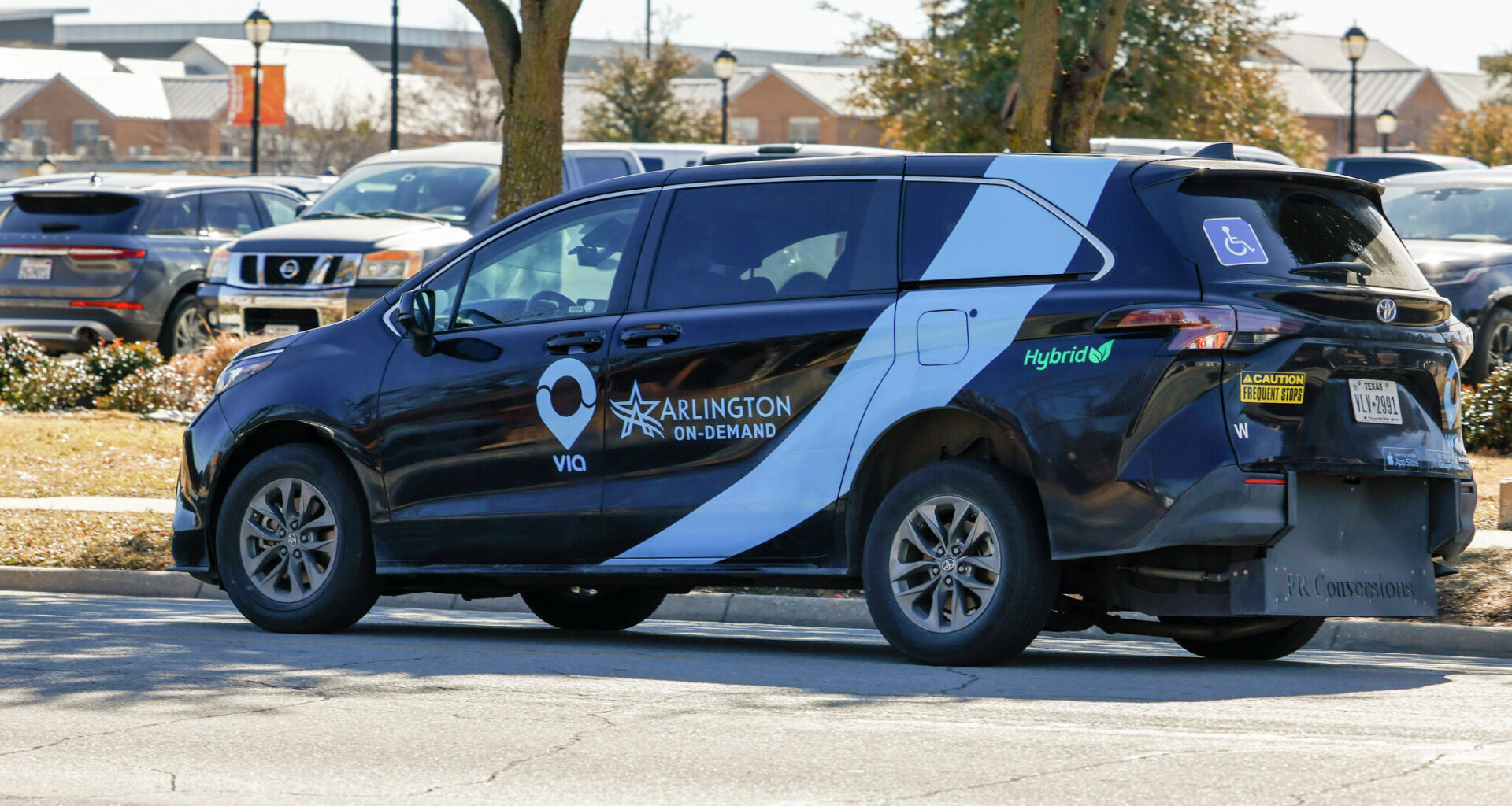 A Via van drives through The University of Texas at Arlington campus, Thursday, Feb. 5, 2026, in Arlington. Via is providing a new microtransit service in Plano called Plano Rides.
