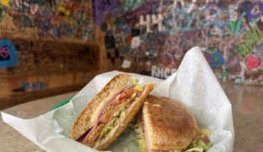 Texas State student Griffin Fisher reads a notice posted outside Alvin Ords in San Marcos on April 14, 2026, stating the restaurant is temporarily closed for an "unknown period of time" due to unforeseen circumstances.