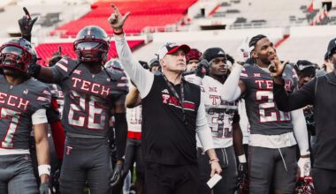 Picture of Texas Tech's black helmet sitting on the red carpet in the Gary Petersen Field Club.