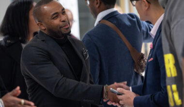 Entrepreneur Deric Durden speaks with other guests at a networking event hosted by Longhorn International Motorsports on Jan. 14, 2026, in Frisco. Durden is a motivational speaker and transition coach.