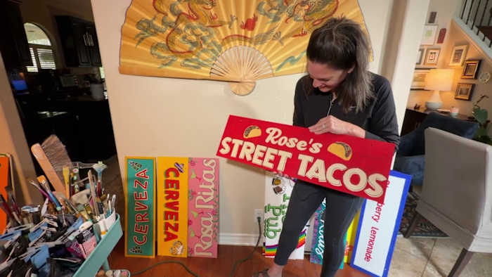 A Night in Old San Antonio’s tradition comes in many forms, including vibrant handmade signs