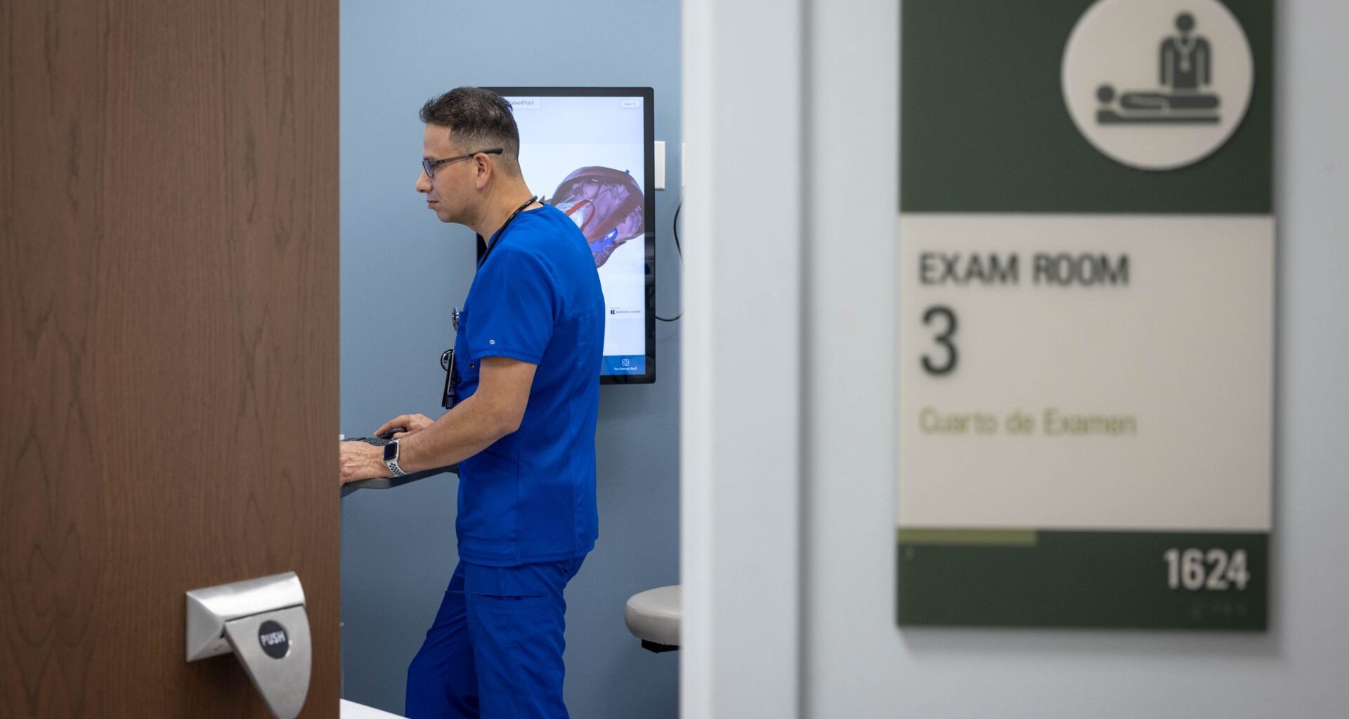 Omar Torres, a licensed vocational nurse, prepares a room for a patient at Parkland's C.V. Roman Health Center in Dallas, Tuesday, April 7, 2026.
