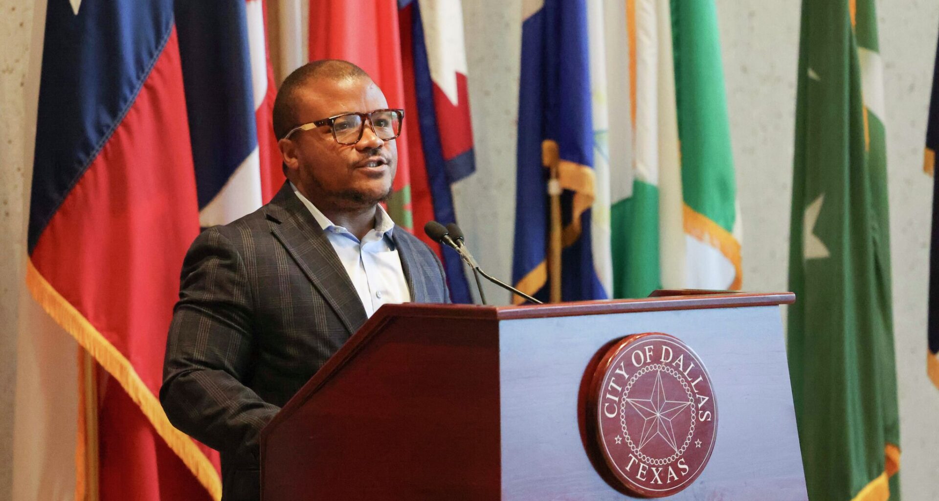 State Rep. Venton Jones, D-Dallas, speaks during a press conference in response to Gov. Greg Abbott's threat to Dallas to revoke public safety funding he says the city may lose because of its rules around collaborating with ICE, at Dallas City Council, on Wednesday, April 22, 2026.