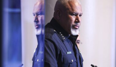 Dallas police Chief Daniel Comeaux listens to questions from reporters during a news conference about an officer shooting over the weekend in Highland Park, at Dallas Police Department, in Dallas, Tuesday, April 21, 2026.