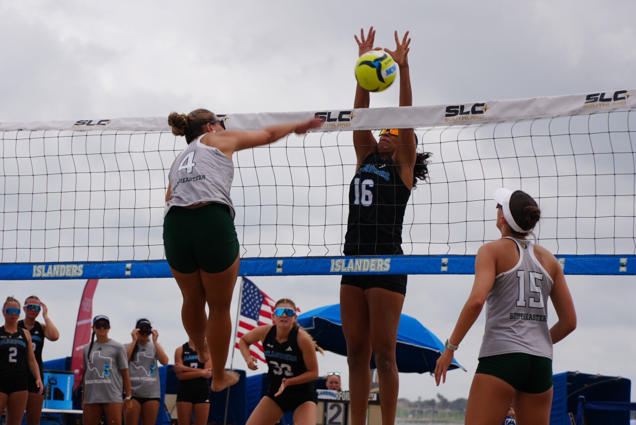 Islanders Maria Duda Fernandes de Melo gets a block in the SLC Semifinal