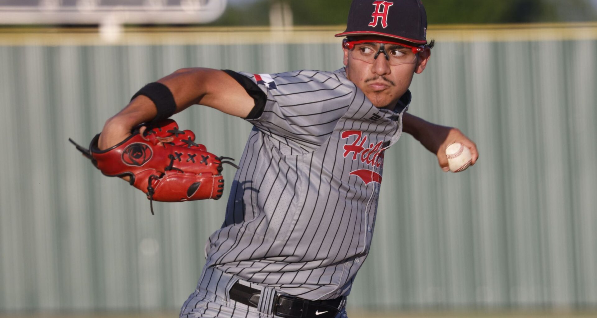 Texas Rangers starting pitcher Nathan Eovaldi, bottom, reacts after giving up a three run home run to Athletics' Carlos Cortes (26) during the fifth inning of a baseball game Friday, April 24, 2026, in Arlington, Texas. (AP Photo/Julio Cortez)