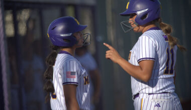 Midland High's Jade Rodriguez (right) gives Gabby Gomez the scouting report on the El Paso Montwood pitcher, April 24, 2026, at Martin Field. 
