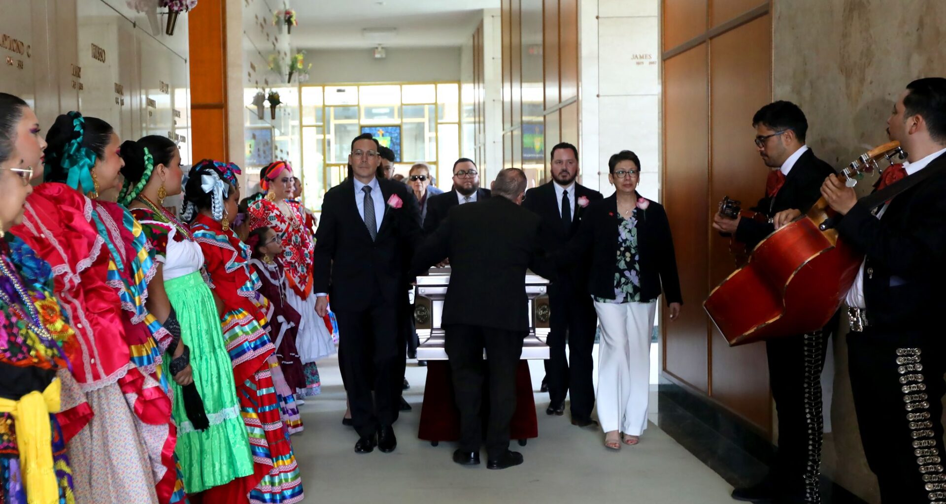 Mariachis and members of Ballet Folklorico line the hall as Anita N. Martinez’s casket is taken down the hall during her funeral in Dallas, Texas, Monday, April 27, 2026. Martinez was the first Mexican American person elected to the Dallas City Council. Anita was also the founder of Ballet Folklorico.
