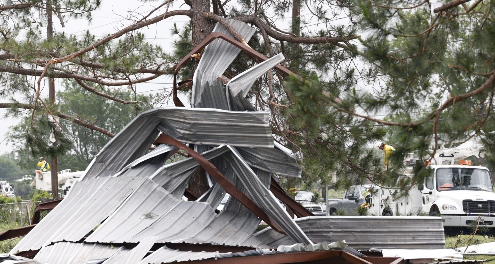 A metal building rests twisted in a tree after a possible tornado, Sunday, April 26, 2026, in Springtown, Texas.