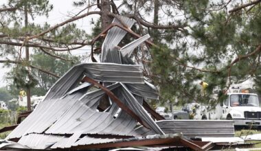 A metal building rests twisted in a tree after a possible tornado, Sunday, April 26, 2026, in Springtown, Texas.