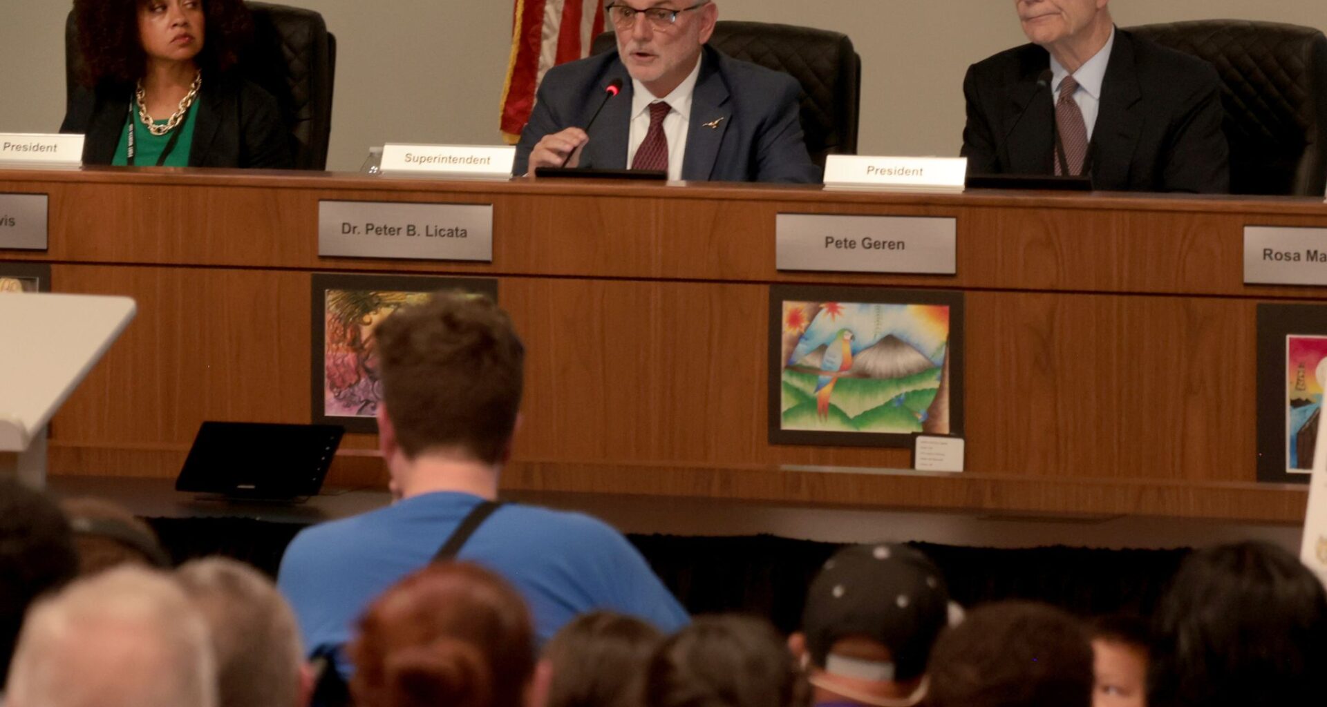 Fort Worth ISD Superintendent Dr. Peter Licata (center) explains to a capacity crowd the necessity for proposed changes within the district as board President Pete Geren (right) and Vice President Courtney Lewis listen during the Fort Worth ISD School Board’s regular meeting held in their Board Room at 7060 Camp Bowie Boulevard in Fort Worth, on April 28 2026.