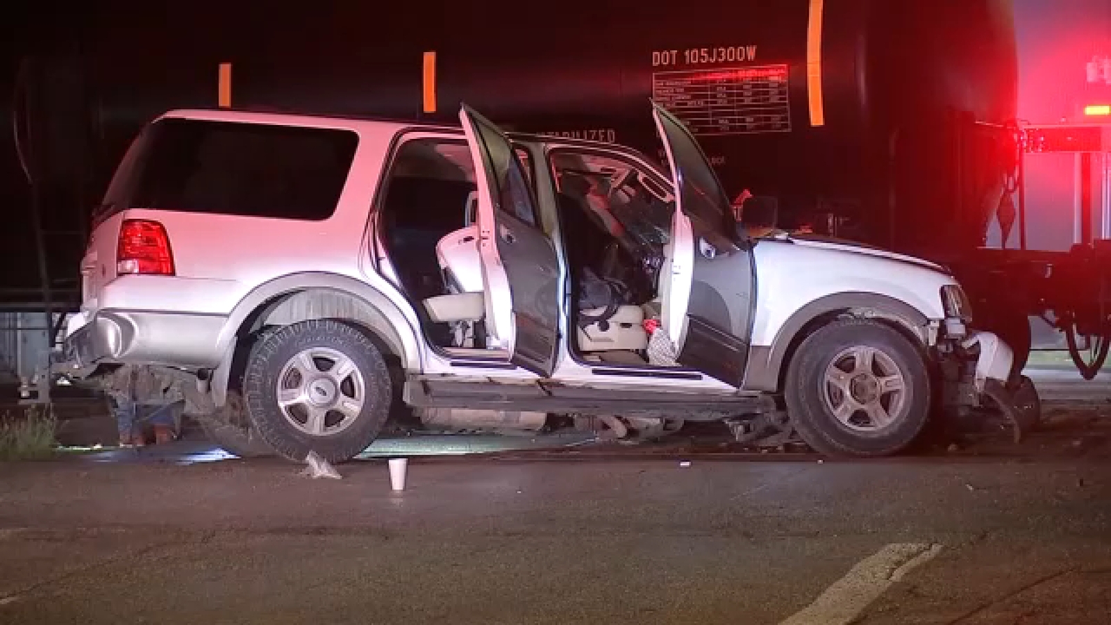 Woman and two dogs expected to be OK after Union Pacific freight train clips car near downtown Houston on Sampson Street, HPD says