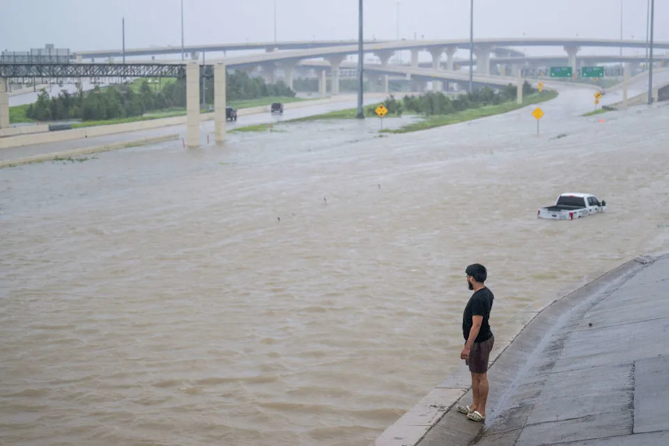 A person looks out towards the flooded interstate after Hurricane Beryl swept through the area on July 8, 2024 in Houston, Texas. (Brandon Bell/Getty Images)