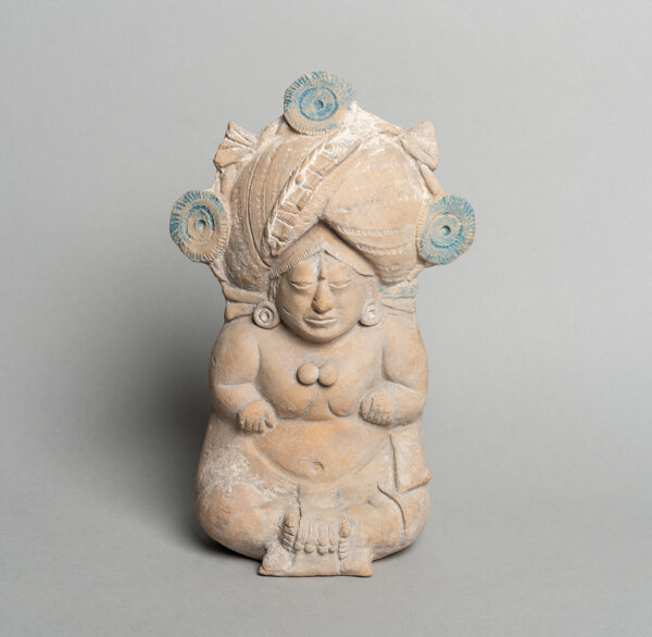 A photograph of a small earthenware figurine. 
