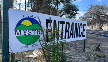 A white sign that says "entrance" is displayed at the Camp Mystic entrance in Hunt, Texas on Dec. 26, 2025.