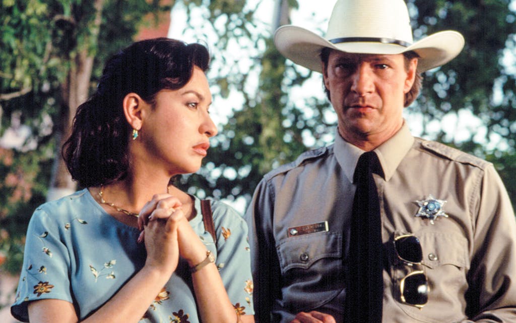 Elizabeth Peña and Chris Cooper in Lone Star.