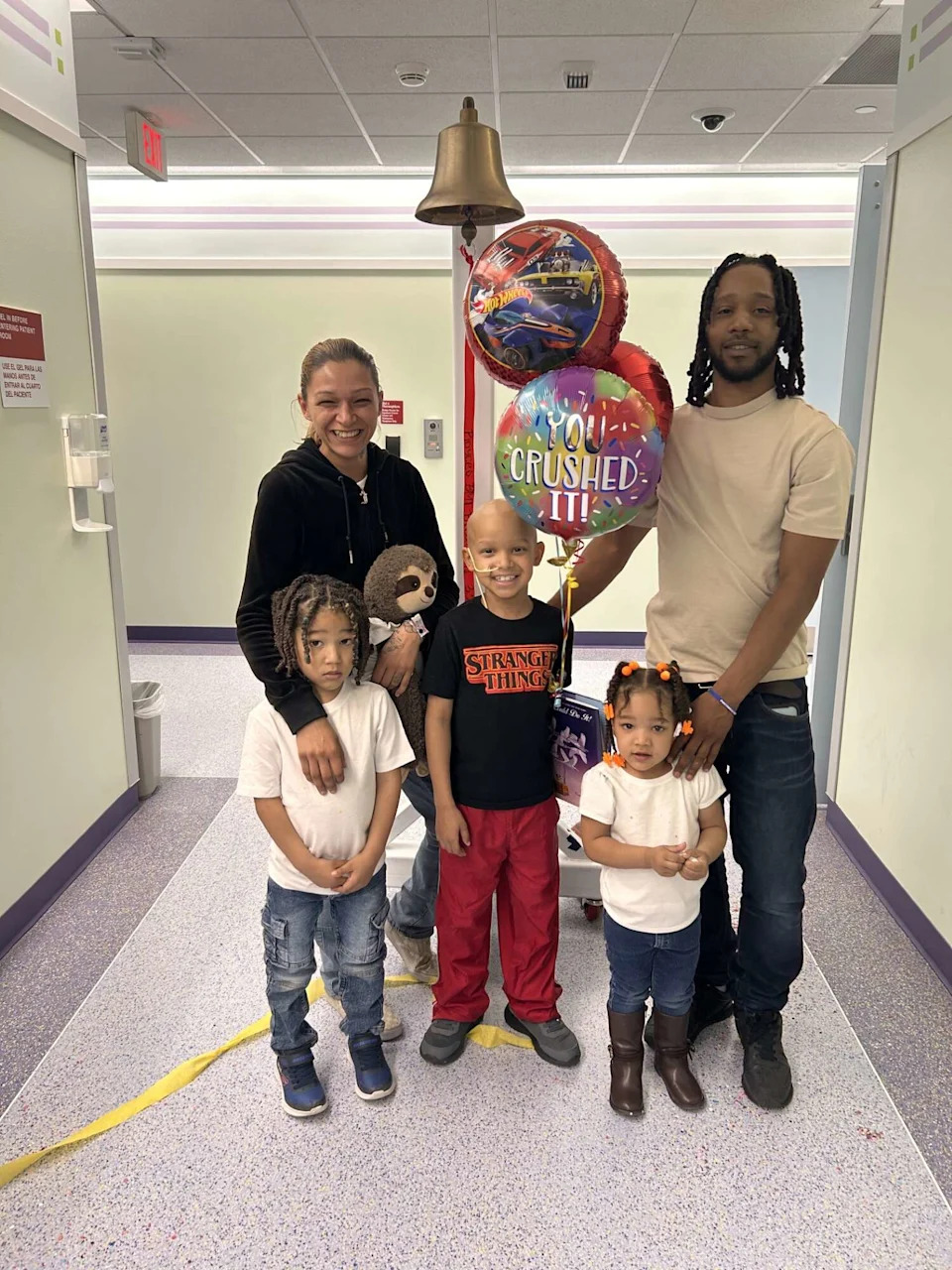 Royce Dinkins poses with his parents and siblings at Cook Children's in Fort Worth. (Joryal Hudson)