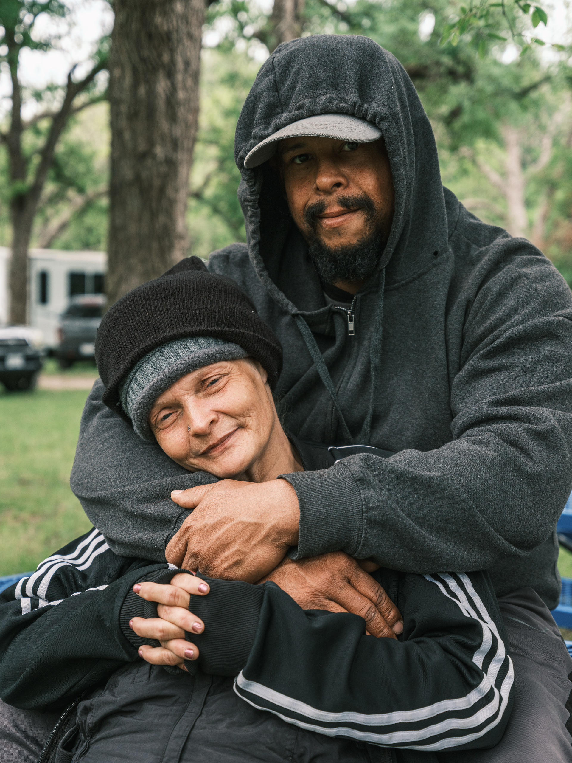 Chris Fisher and Wyndi Henderson hold each other during Church Under the Bridge’s annual Easter service.