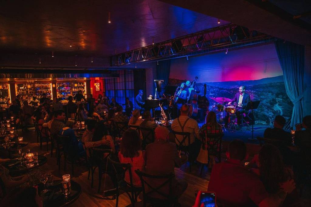 Image shows the interior of Jazz, Texas in San Antonio featuring a live music performance.
