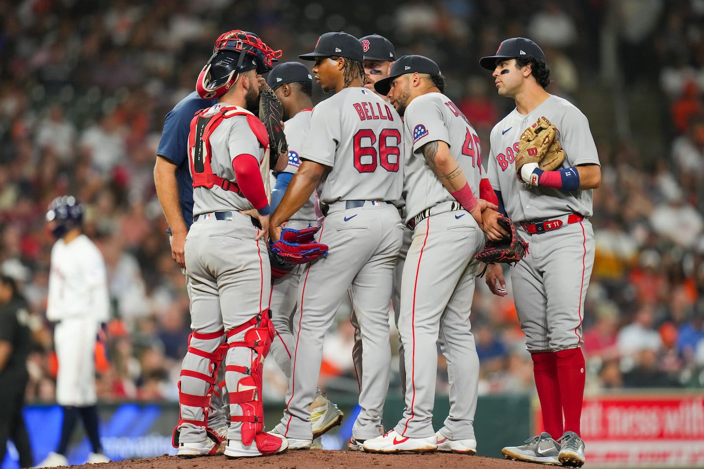 Brayan Bello (66) and the Red Sox talk it over in the fifth inning Tuesday night in Houston, when Bello was undone by an umpiring mistake.
