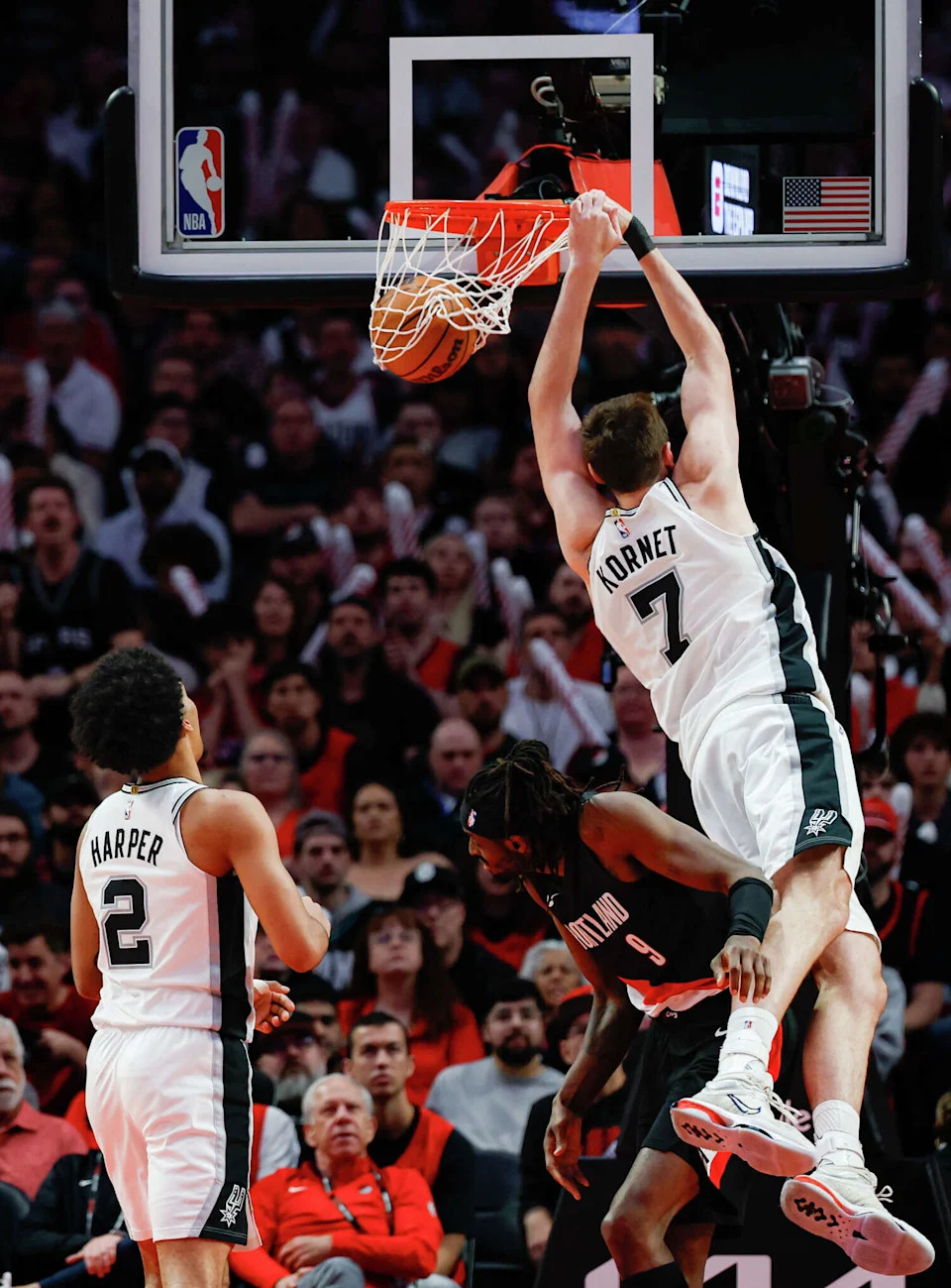 San Antonio Spurs center <a class="link " href="https://sports.yahoo.com/nba/players/5903/" data-i13n="sec:content-canvas;subsec:anchor_text;elm:context_link" data-ylk="slk:Luke Kornet;sec:content-canvas;subsec:anchor_text;elm:context_link;itc:0" data-yga="{"yLinkElement":"context_link","yModuleName":"content-canvas","yLinkText":"Luke Kornet","ySubModuleName":"anchor_text","yHasCommerce":false}">Luke Kornet</a> (7) slams down a pass from San Antonio Spurs guard Stephon Castle (5) during the third quarter of Game 4 of a first-round NBA playoff series at Moda Center on Sunday, April 26, 2026. (Sam Owens/San Antonio Express-News)
