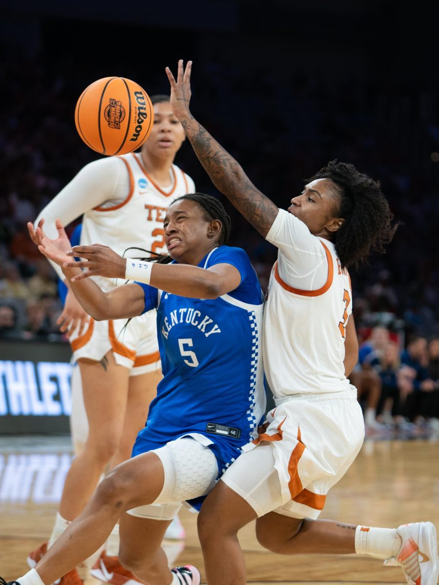 Senior Rori Harmon deflects the ball away from Wildcat senior Tonie Morgan during the Sweet 16 against the Kentucky Wildcats on March 28.