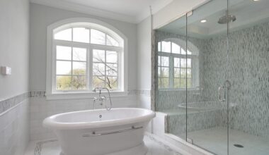 Modern bathroom remodeling project in Plano, Texas featuring a freestanding tub, walk-in glass shower, and custom tile installation by a local remodeling contractor.