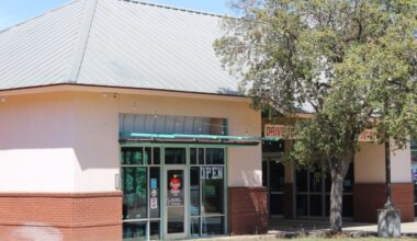 The exterior of a taco restaurant on a sunny day.