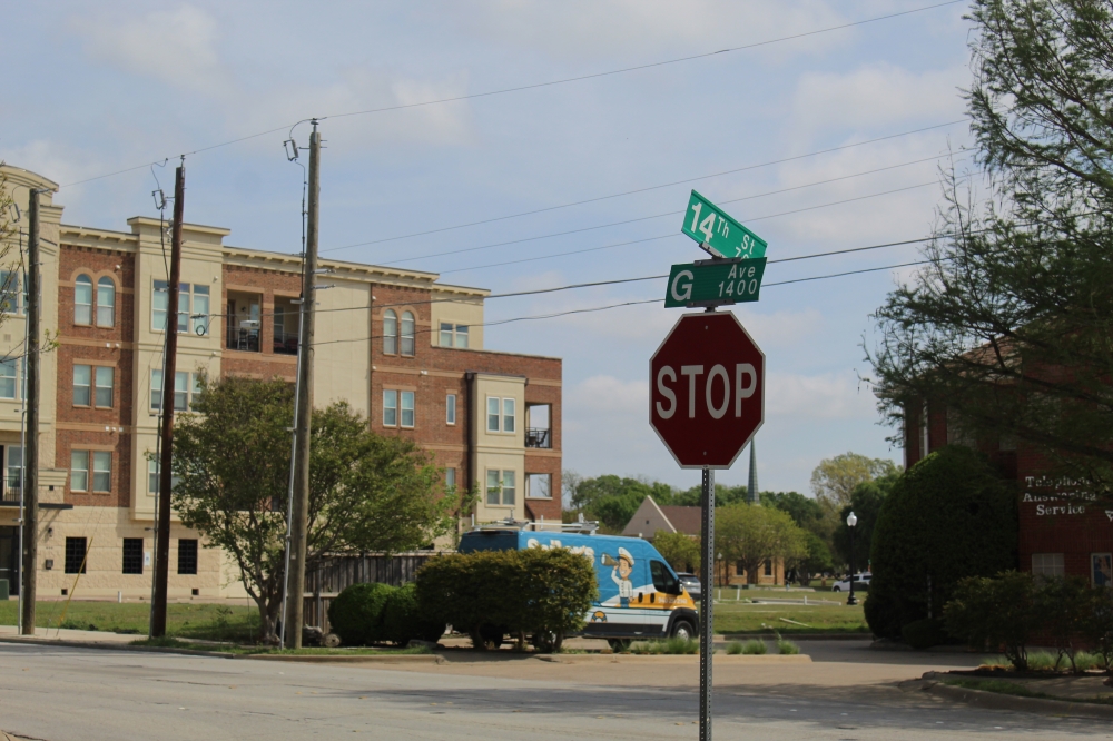 A stop sign at the intersection of G Avenue and 14th Street