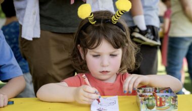 A young attendee colors at the Books and Bees Festival at Bee Cave Public Library, where literacy programming meets live bee education. (Courtesy Bee Cave Public Library)