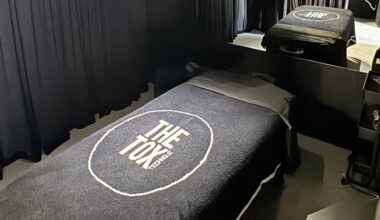 Interior of spa room featuring The Tox-branded bed linens.