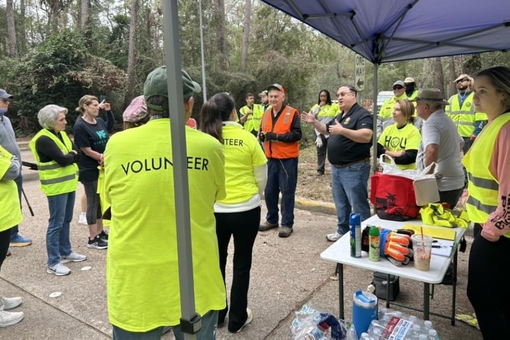 Fred Flickinger, who represents Houston City Council District E, speaks to volunteers during a Median Madness event in Kingwood. (Courtesy Houston City Council District E)