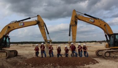 Dripping Springs ISD officials pose with shovels to commemorate the groundbreaking of High School No. 2. (Sienna Wight/Community Impact)
